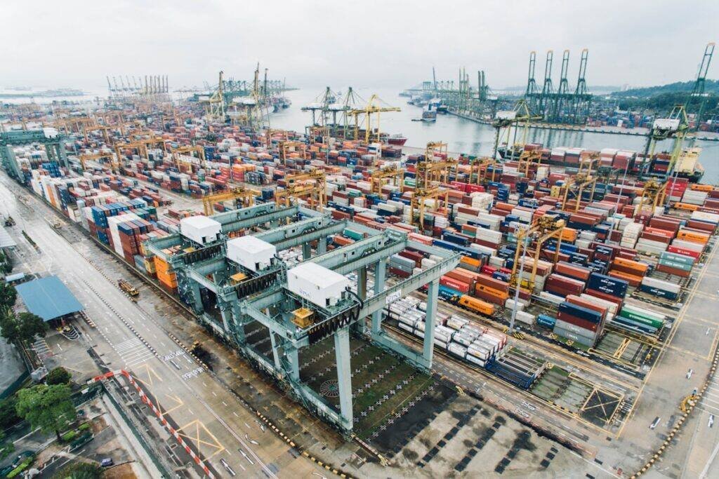 Stacked shipping containers at a logistics yard